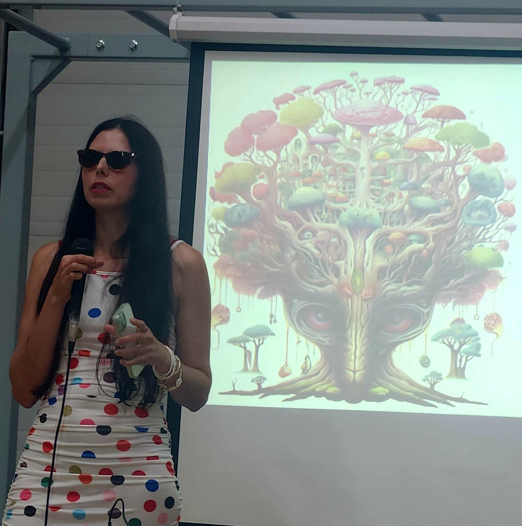 Autistic professional speaker Layla Messner Autistic professional speaker Layla Messner presenting in front of a screen with a stylized image of a brain. Canmore, Alberta, Canada.